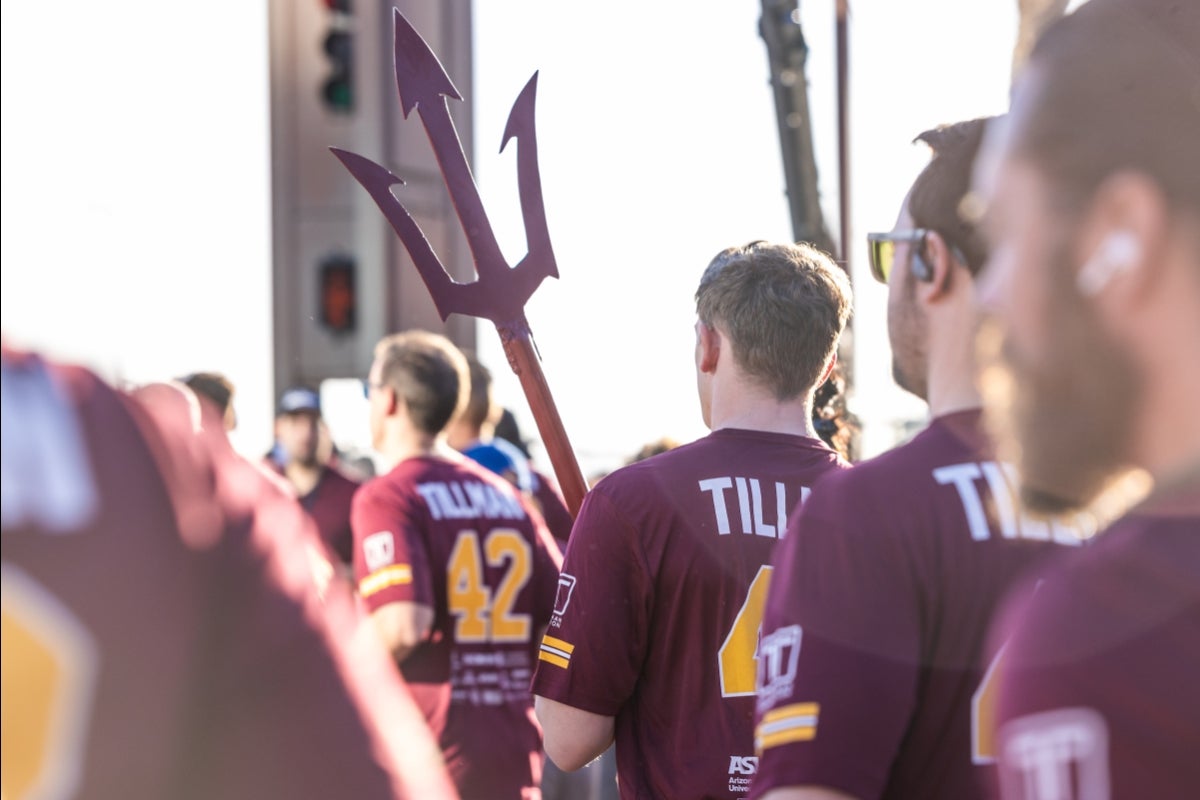 Race attendees holding a pitchfork