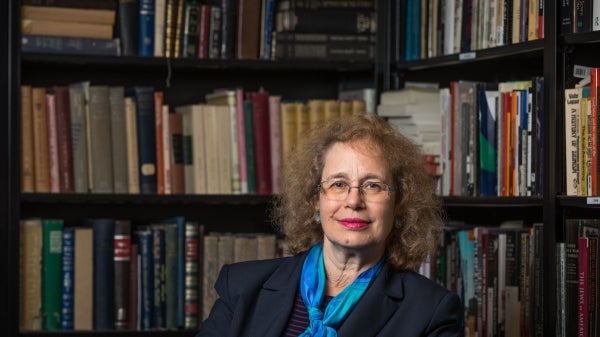 Hava Tirosh-Sameulson sits in front of bookshelves.